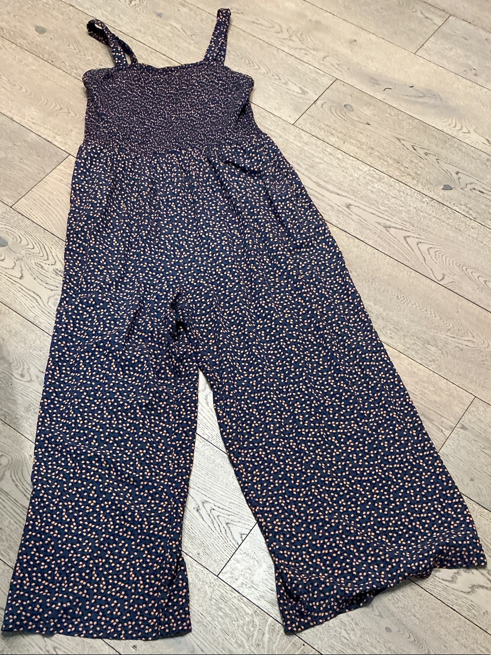 Woman’s Dokotoo blue with flowers pull on jumpsuit. XL. Smocked top. Pockets.